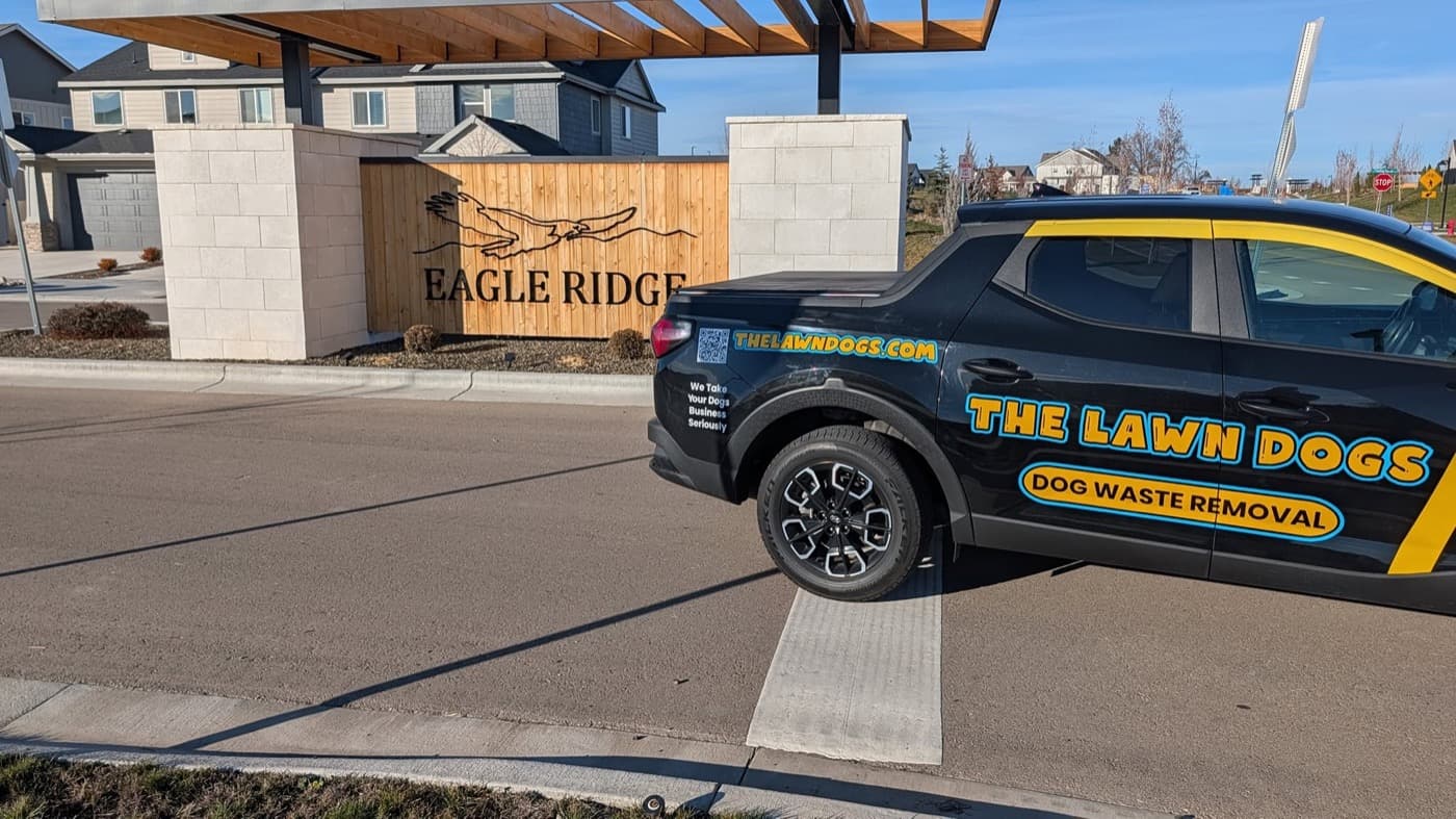 A Lawn Dogs truck at the Eagle Ridge entrance monument in Eagle, Idaho